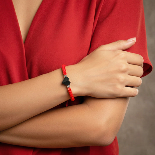 TINY LOVE. PULSERA CON CORAZON NEGRO Y CORDON TRENZADO ROJO
